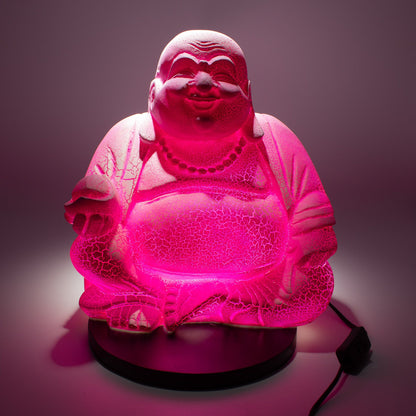 Pink Buddha lamp with cracked texture on a dark background