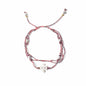 Multistrand bracelet with beads on a white background