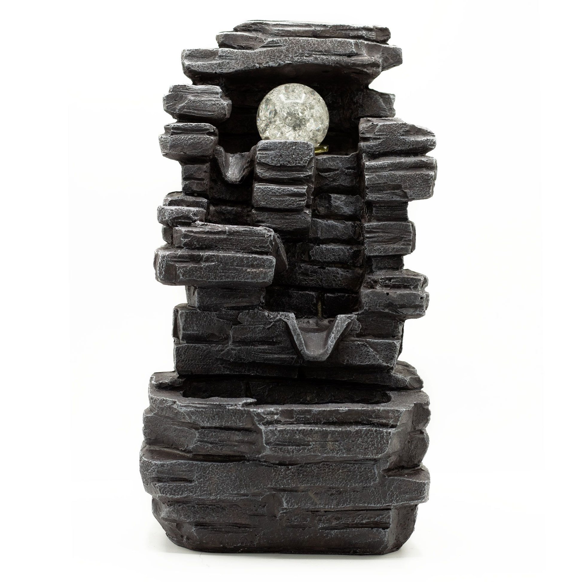 Decorative stone-like water fountain on a white background