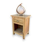 Wooden side table with a decorative item on a white background