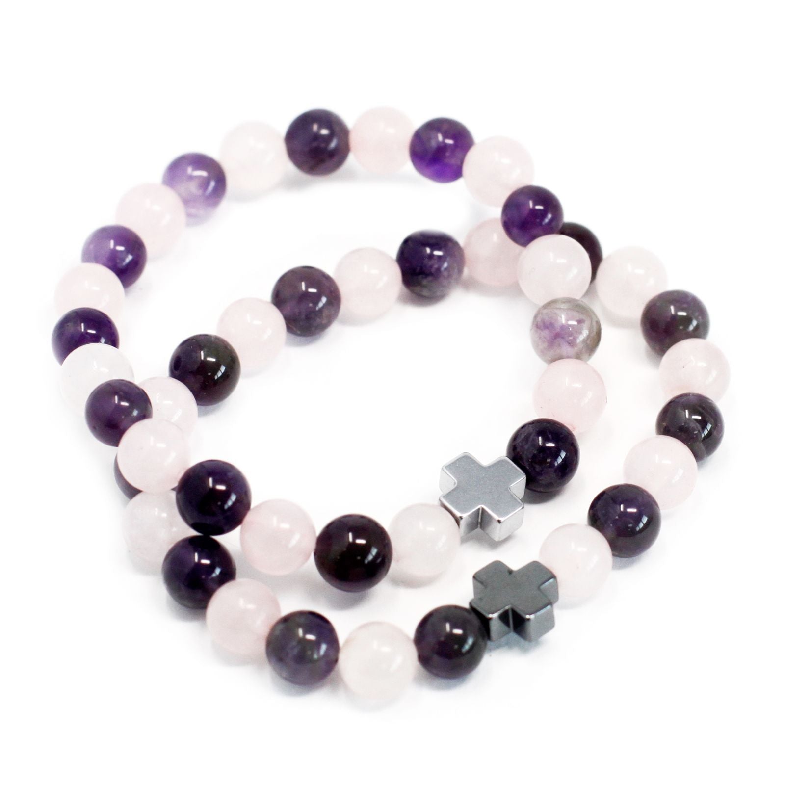Two beaded bracelets with purple and white beads and silver star-shaped charms on a white background.