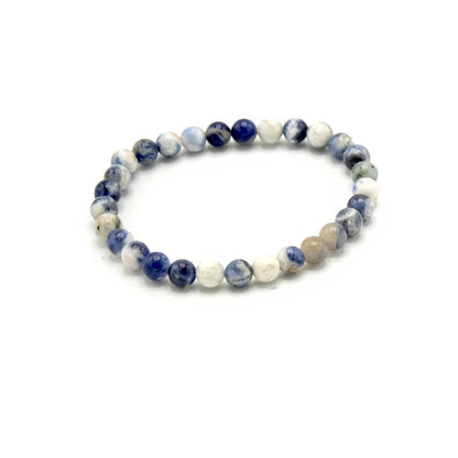Beaded bracelet with blue and white beads on a white background