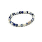 Beaded bracelet with blue and white beads on a white background