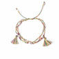 Colorful braided necklace with tassels on a white background