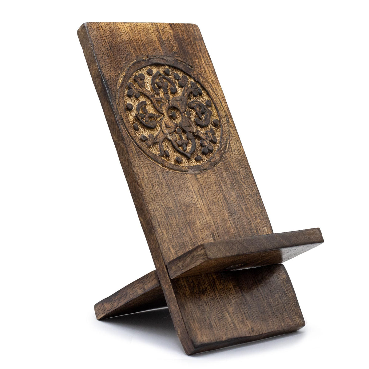 Wooden phone stand with decorative carvings on a white background