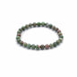 Green beaded bracelet on a white background