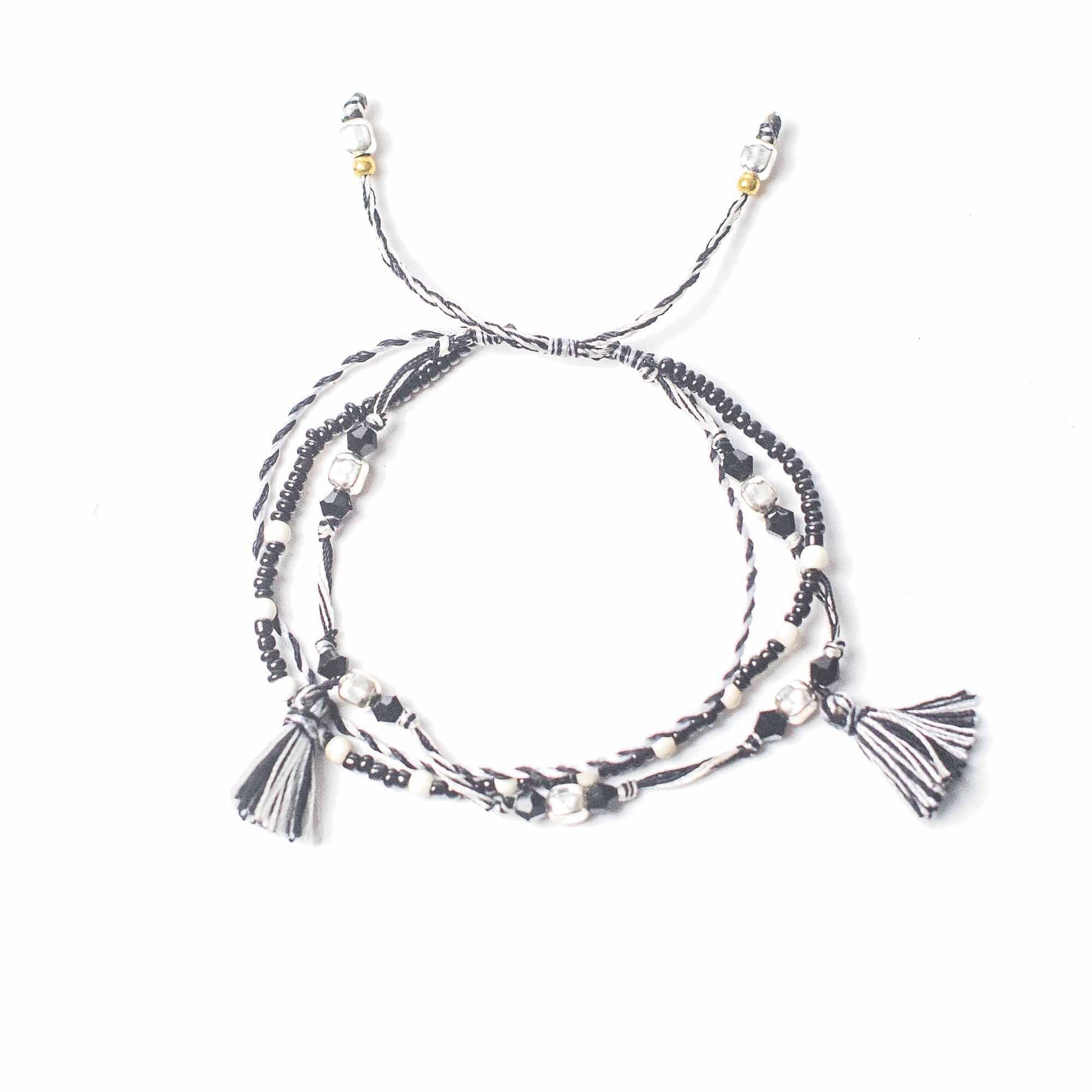 Multi-strand bracelet with tassels on a white background