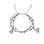 Multi-strand bracelet with tassels on a white background