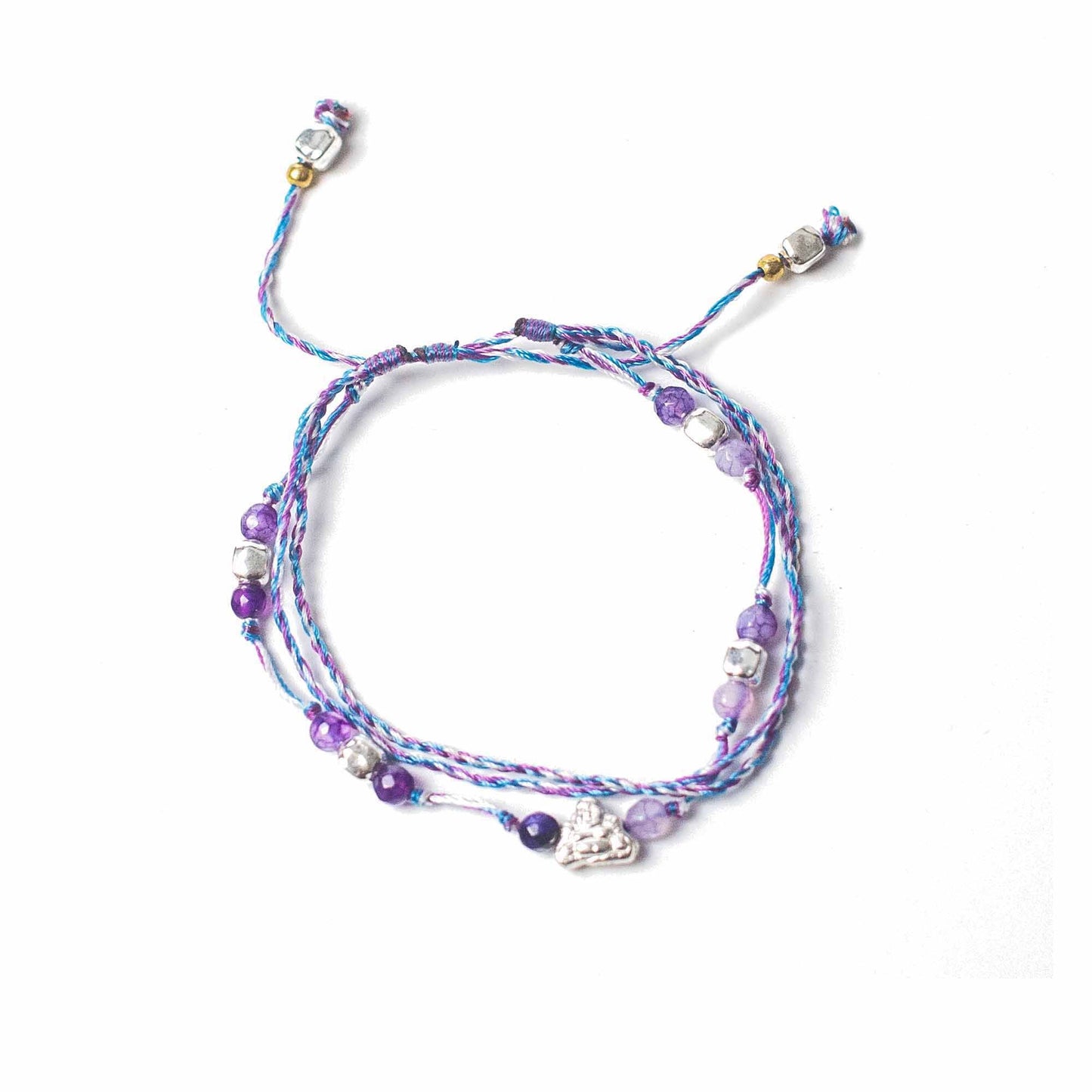 Multicolored beaded bracelet with charms on a white background