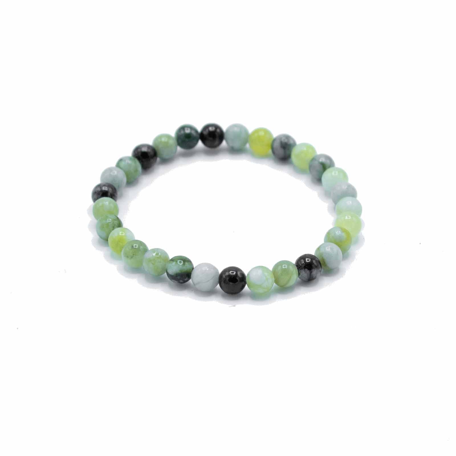 Beaded bracelet with green and black beads on a white background