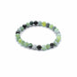 Beaded bracelet with green and black beads on a white background