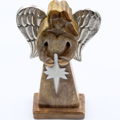 Wooden angel figurine with wings and a star on a white background