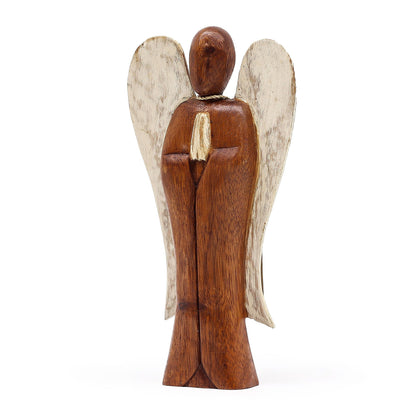 Wooden angel figurine with white wings on a white background