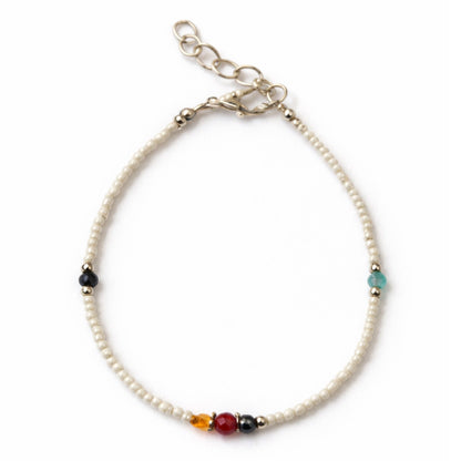 Pearl bracelet with colorful beads on a white background