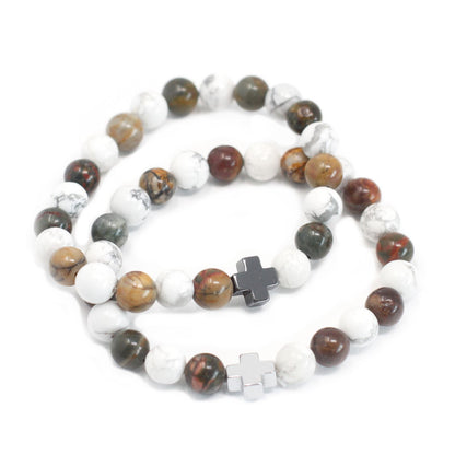 Beaded bracelet with crosses on a white background