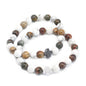 Beaded bracelet with crosses on a white background