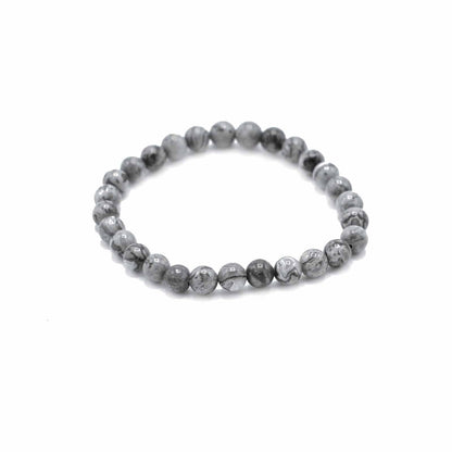 Grey beaded bracelet on a white background