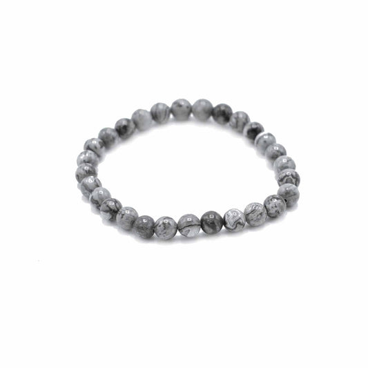 Grey beaded bracelet on a white background